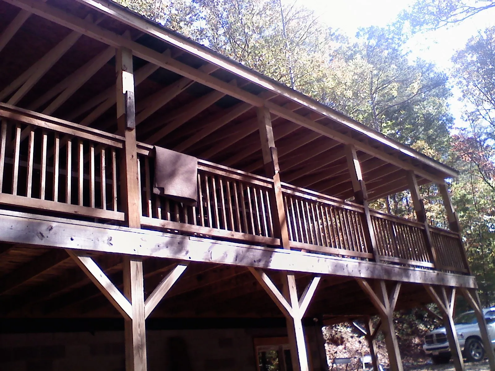 Timber framing under a new elevated porch and deck — Roof Leak Repair in Huntsville by Roofing Brothers